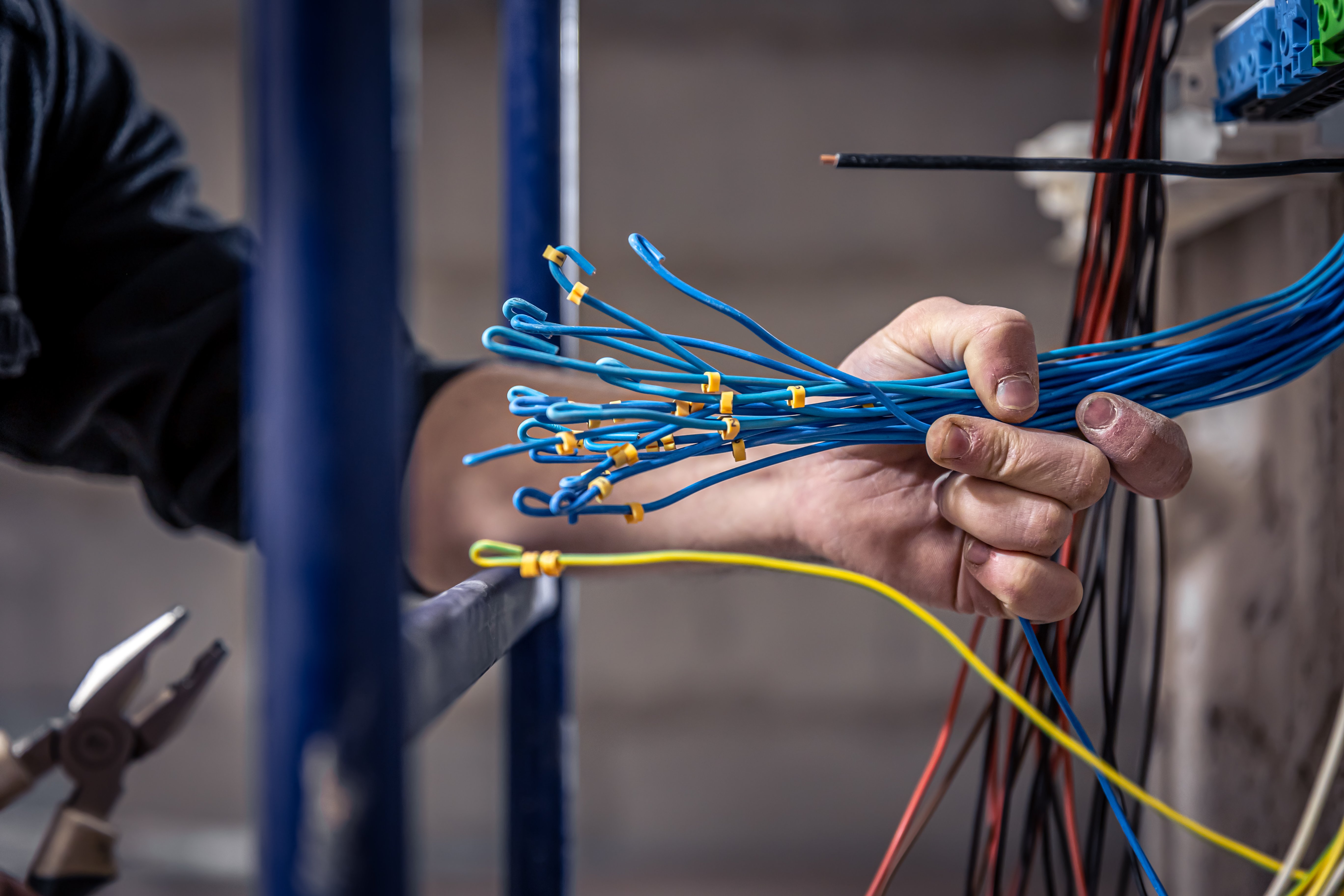 Electrician Working on Switchboard
